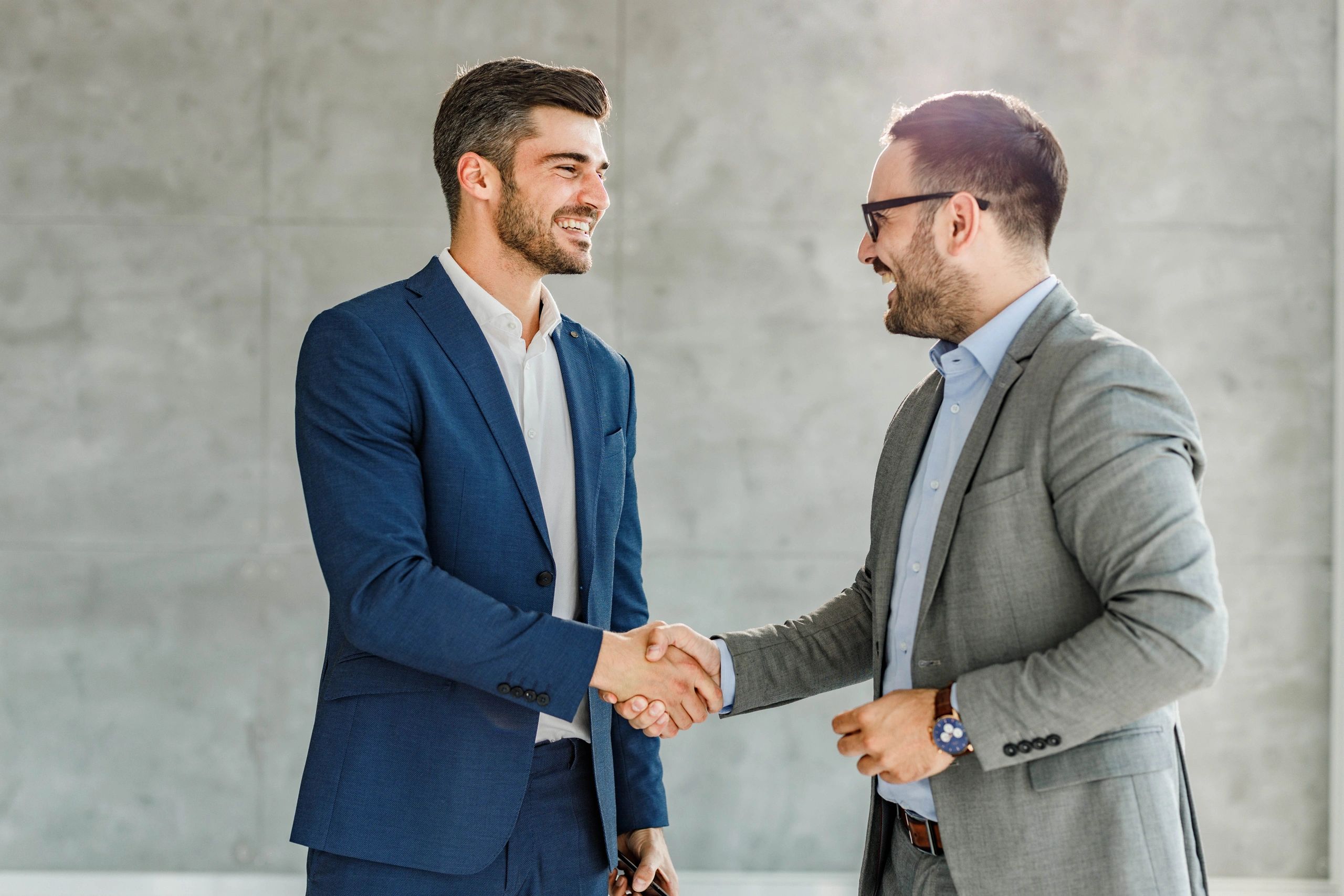 Two business professionals shaking hands after a successful meeting