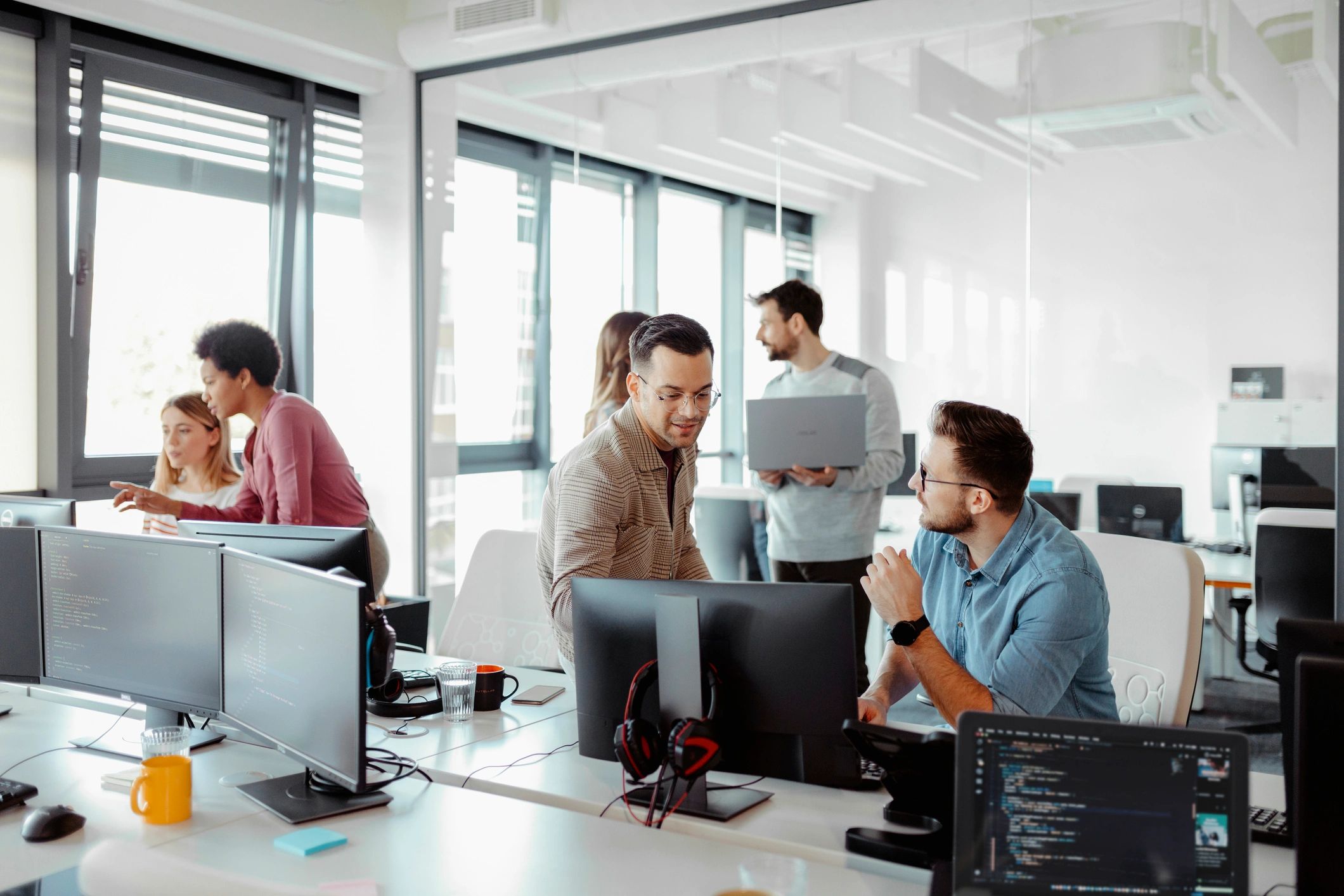 IT team collaborating in a modern office